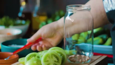 Preparation of green tomato pickle Stock Footage 249814731