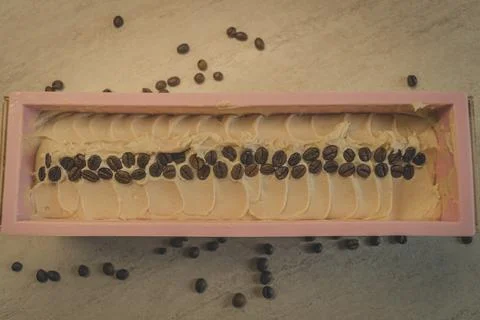Preparation of handmade soap. The base for soap in silicone form, decorated with Stock Photos