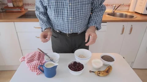 Preparation of a Healthy Breakfast Displayed on a Kitchen Counter Stock Footage 307742634