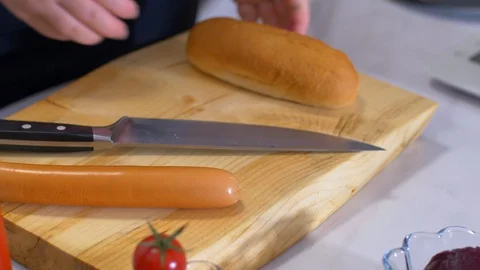 Preparation of hot dogs. adding ketchup and mustard Stock Footage 111273145