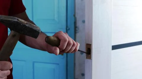 Preparation for inserting the lock into the room door Stock Photos