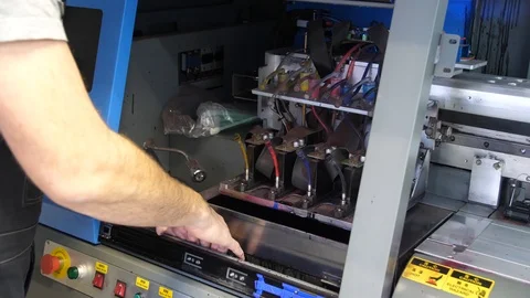 Preparation for the large-format inkjet printing press. Male hands worker merge Stock Footage 99525358