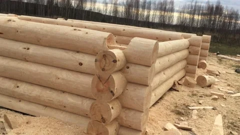 Preparation of logs for the assembly of the structure. Video stock 239200453