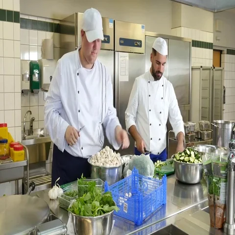 Preparation for lunch in a commercial kitchen. Stock Footage 69485980