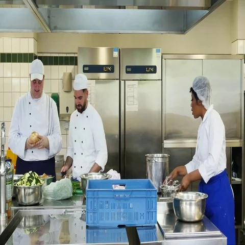 Preparation for lunch in a commercial kitchen. Stock Footage 69486249