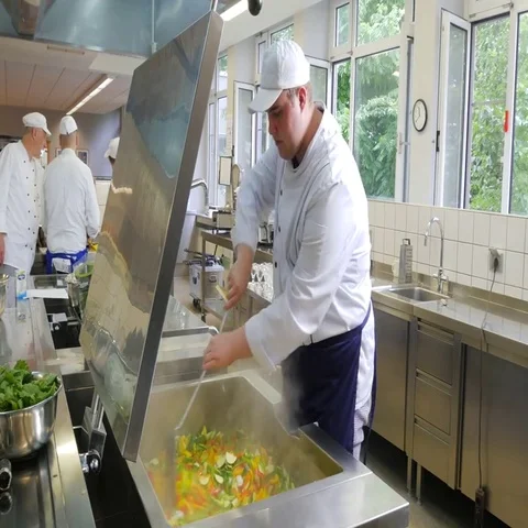 Preparation for lunch in a commercial kitchen. Stock Footage