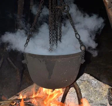 Preparation of the magic potion into the cauldron Stock Photos