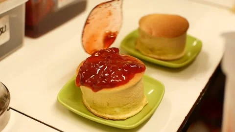 Preparation for making pancakes with strawberry jam Stock Footage 220657891