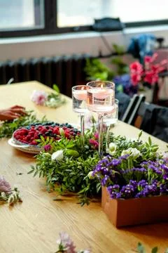 Preparation for a master class in floristry. Table decor elements (wreath of  Stock Photos
