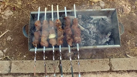 Preparation of meat on fire. Stock Footage 77426540
