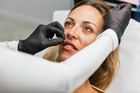 Preparation for microblading, eyebrow design with thread marking Stock Photos
