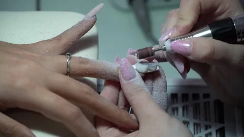 Preparation of nails with a manicure machine for manicure 스톡 동영상 330464886