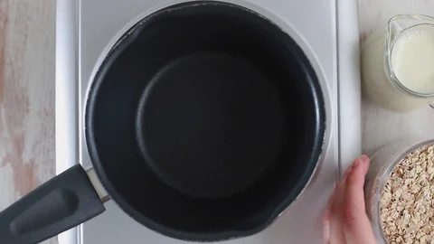 Preparation oatmeal with milk Video stock 88798689