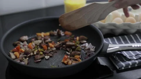 Preparation of an omelette for breakfast. Stock Footage 148929613