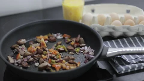 Preparation of an omelette for breakfast. Stock Footage 148929614