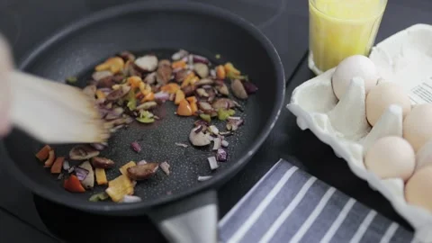 Preparation of an omelette for breakfast. Stock Footage 148929623