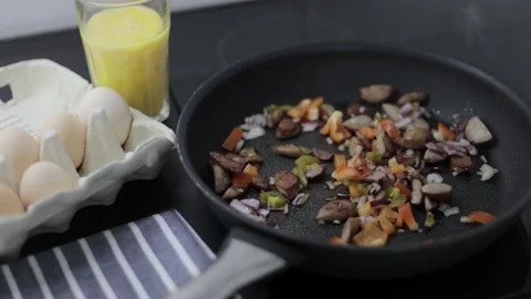 Preparation of an omelette for breakfast. Stock Footage 148929624