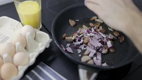 Preparation of an omelette for breakfast. Stock Footage 148930159