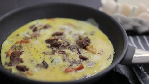 Preparation of an omelette for breakfast. Stock Footage 148930855