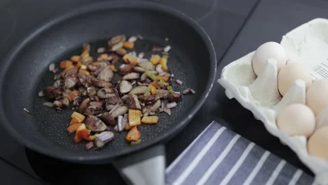 Preparation of an omelette for breakfast. Stock Footage 148930887
