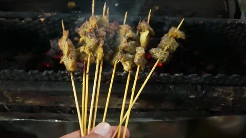 Preparation of the Padang satay dish Stock Footage 287702691