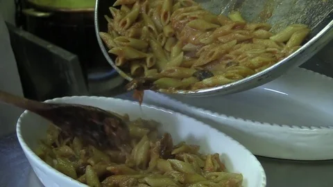 Preparation of pasta dish Stock Footage 79564073