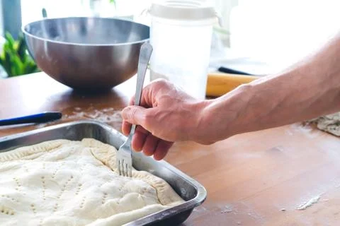 Preparation of patty for baking. Kitchen concept. Man's hand. Stock Photos