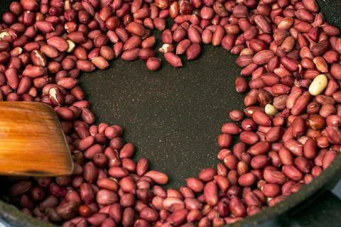 Preparation of peanuts as a source of vegetable protein. peanuts were fried i Stock Photos