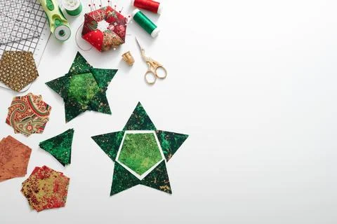Preparation of pentagon and triangular pieces of fabric for sewing patchwor.. Stock Photos