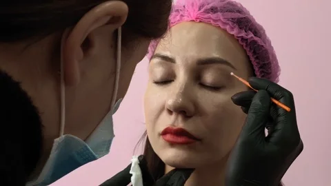 Preparation for permanent makeup. Draws a contour with a red pencil. Cosmetology Video stock 119892172
