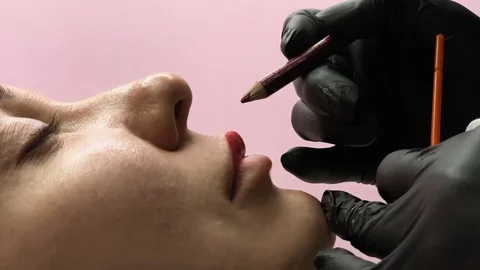Preparation for permanent makeup. Draws a contour with a red pencil. Cosmetology Video stock 119892268