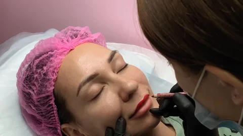 Preparation for permanent makeup. Draws a contour with a red pencil. Cosmetology Video stock 119892655