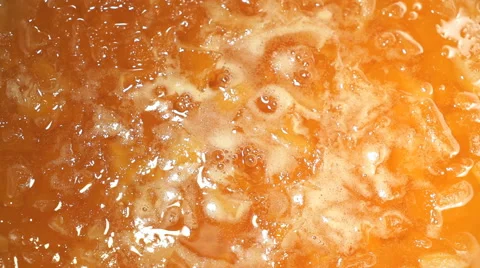 Preparation of pumpkin jam on the hob in a saucepan Stock-Footage 59723398