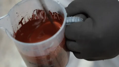 Preparation of red varnish Stock Footage 86238829
