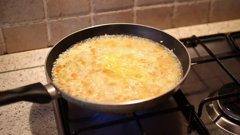 Preparation of risotto with pumpkin Stockbeeldmateriaal 71031144