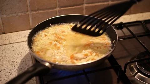 Preparation of risotto with pumpkin Stockbeeldmateriaal 71039854