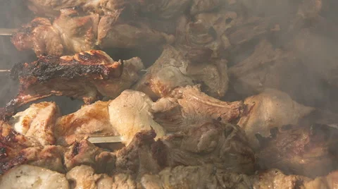 Preparation of roasted meat on the fire for a picnic. Stock Footage 65787615