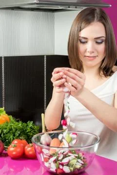 Preparation of salad in the kitchen Stock Photos