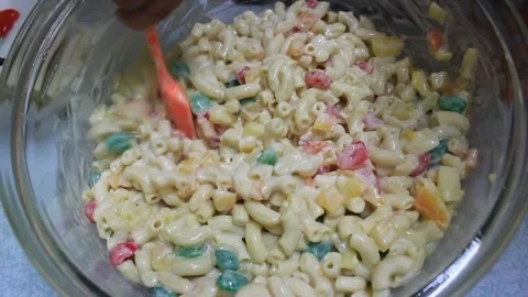 Preparation for serving fresh mix with milk macaroni Stock Footage 224945344