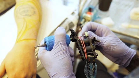Preparation, setting up a tattoo machine for the session Stock Footage 122293869