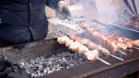 Preparation of a shish kebab. Close up. Coals and meat. Tasty treat. Stock Footage 125568171