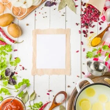 Preparation of soup at home. Rustic white background with vegetables and in.. Stock Photos