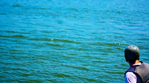 Preparation for the start of a young man on a water board Video stock 37780997