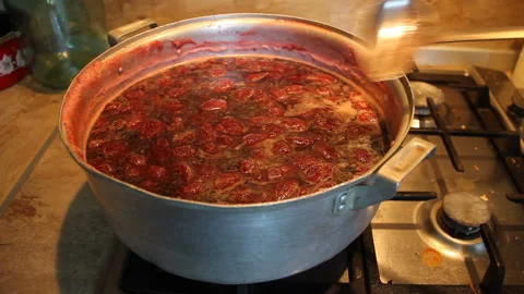 Preparation of strawberry jam. Cook jam. A woman's hand with a ladle neatly Stock Footage 90820644