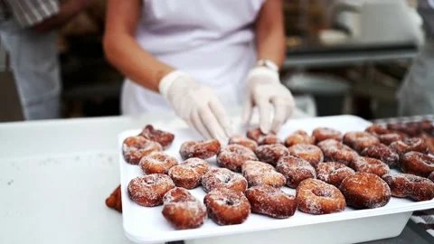 Preparation of sugar donuts Stock Footage 168416624