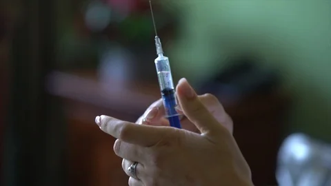 Preparation of syringe for injection Stock Footage 106013300