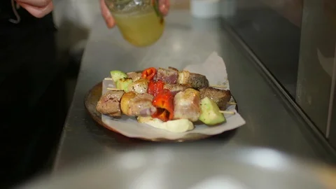 Preparation of tasty beef meat and vegetables mix skewered on wooden sticks Video stock 124854657