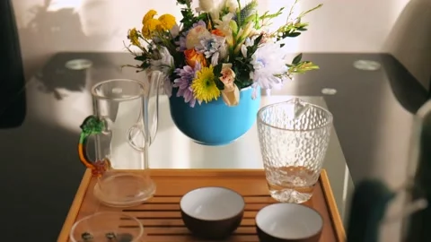 Preparation for tea drinking on a tea board. tea set for chinese tea ceremony Stock Footage 220341701