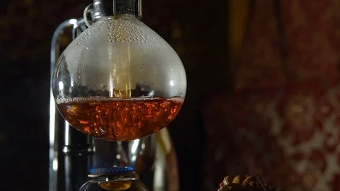 Preparation of tea in siphon Stock Footage 74450943