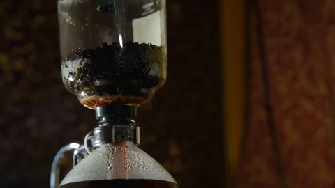 Preparation of tea in siphon Stock Footage 74450991